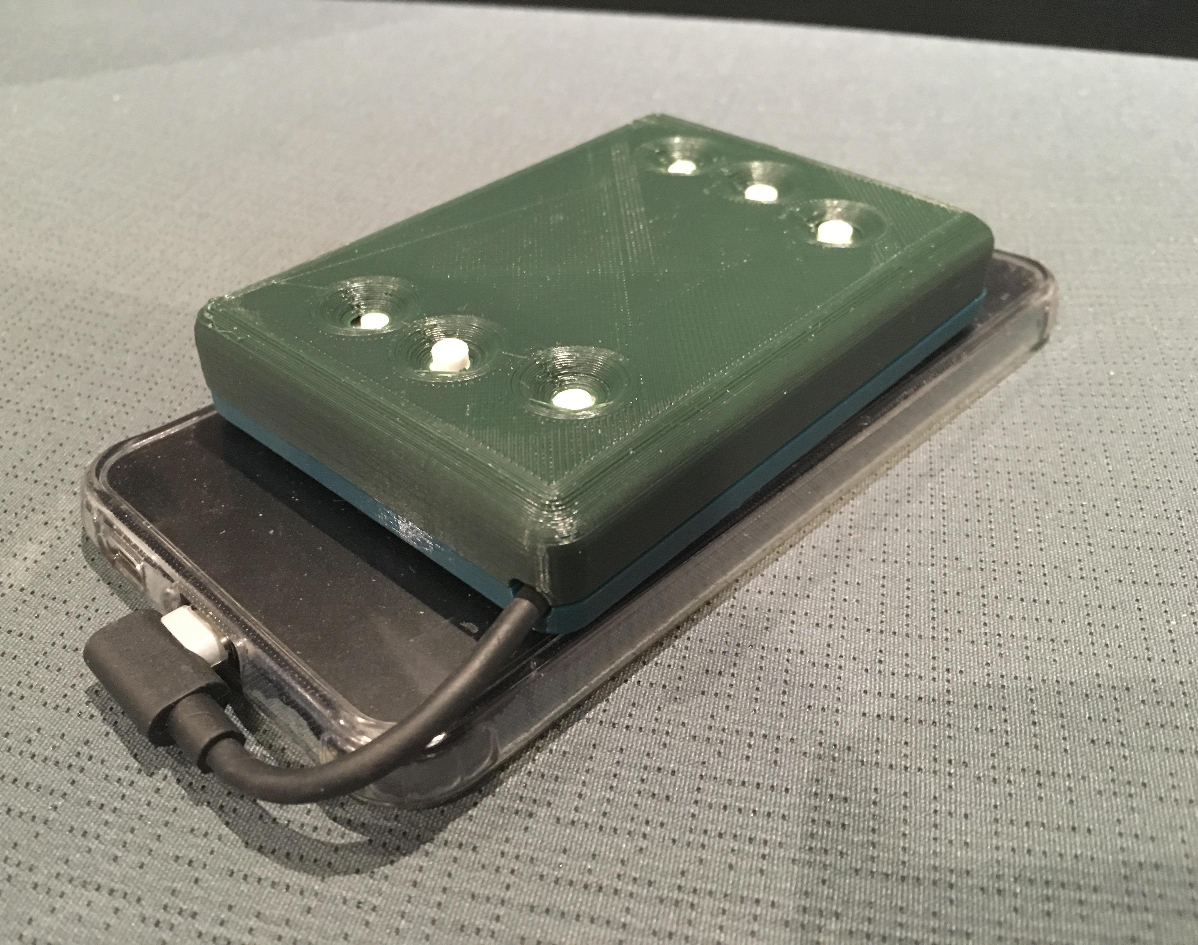 Expressing Braille Through Vibrations: a Portable, Inexpensive Braille Display
